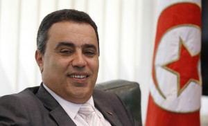 Tunisia's Industry Minister Mehdi smiles in his office in Tunis